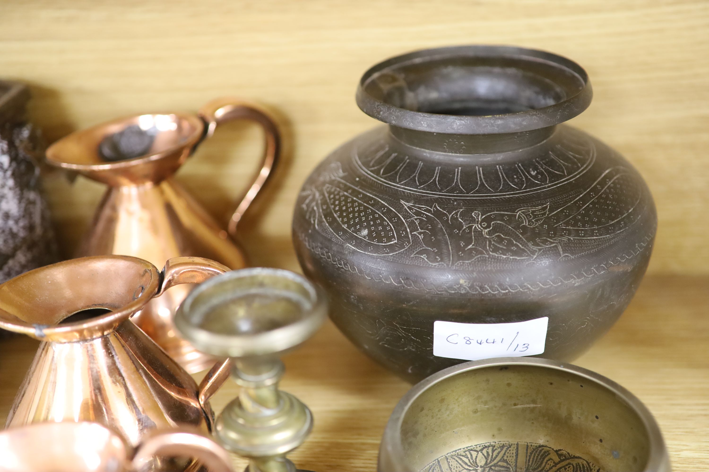 Four copper graduated measures and mixed metalware including Eastern brass